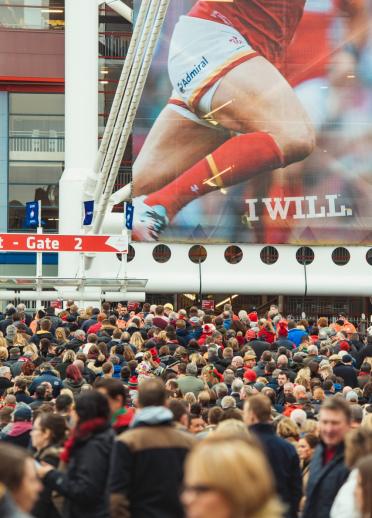 Image of a crowd of rugby fans outside the Principality Stadium.