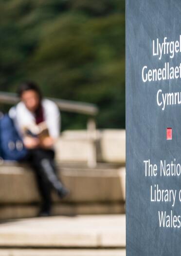 bilingual slate sign 'Llyfrgell Genedlaethol Cymru' 'The National Library of Wales'.