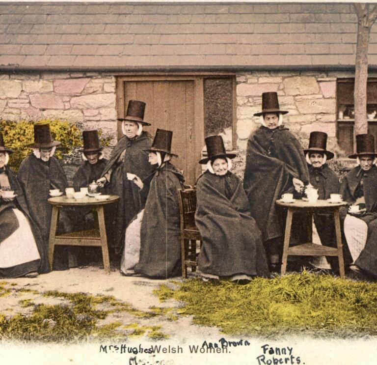 An old postcard showing Welsh women wearing traditional dress