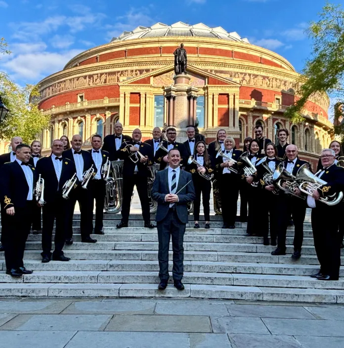 A group of musicians holding their instruments.