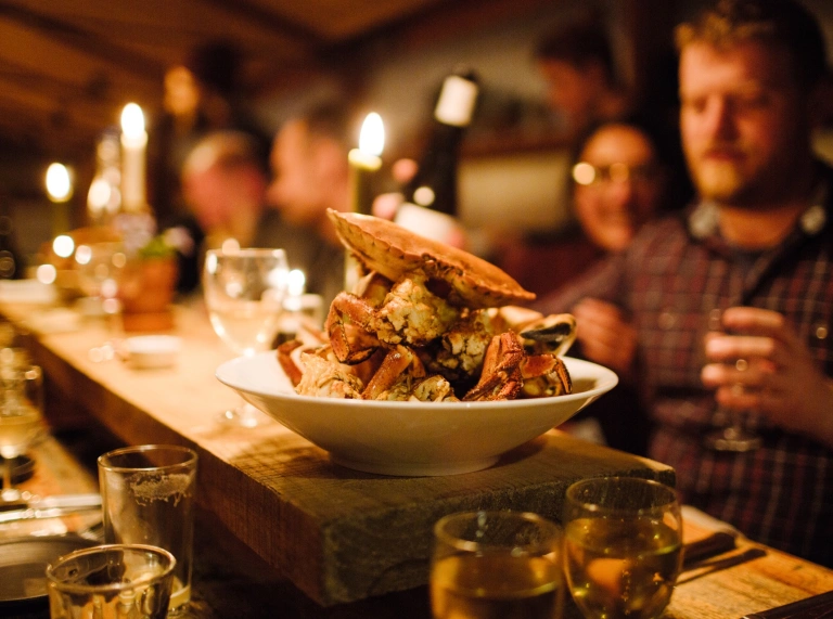 People eating dinner by candlelight.