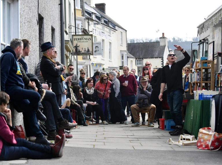 Performers in the street at Laugharne.