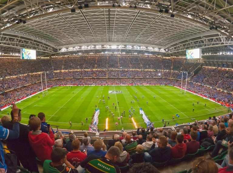 A view of the interior of the stadium with crowds watching a match.