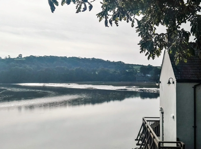 A boat house looking out to water.