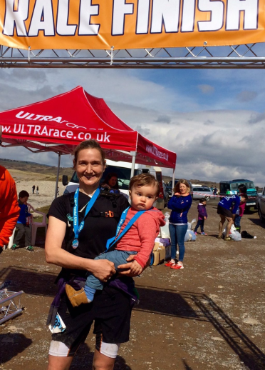 Lowri Morgan holding a child