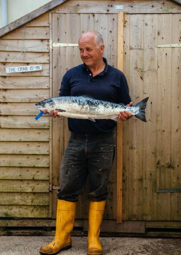 Len Walters holding his catch of the day