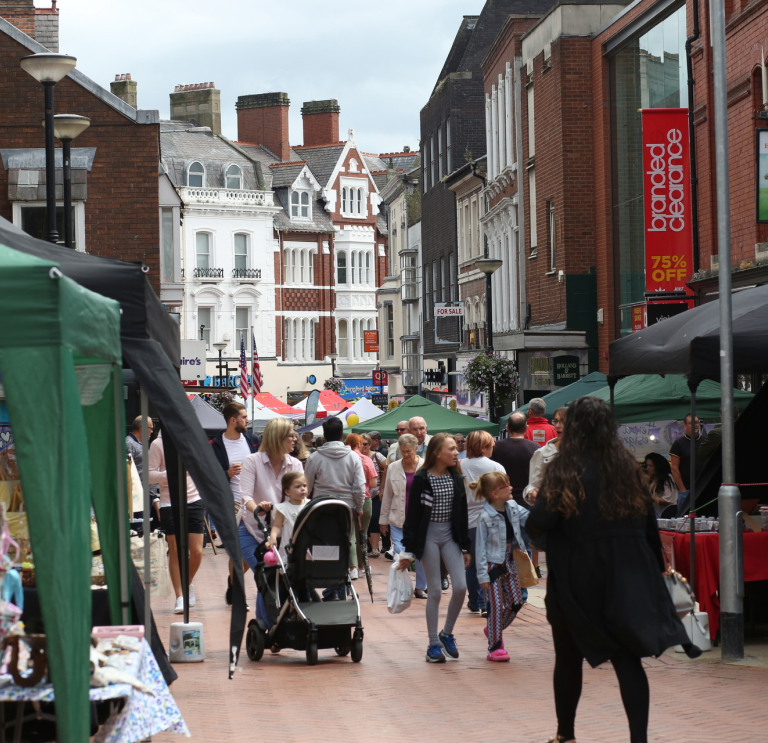 People walking through the town.