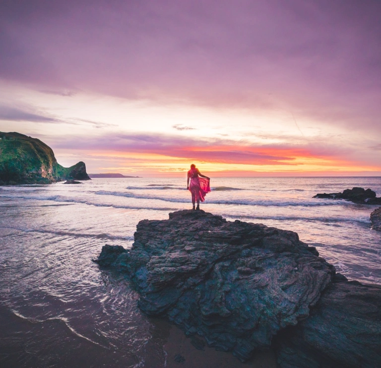 person looking out to sea in Wales