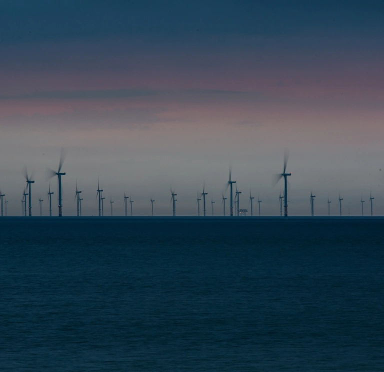 A wind farm in the sea.