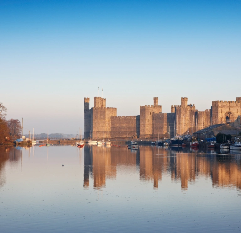 A view of Castell Caernarfon from across the sea.