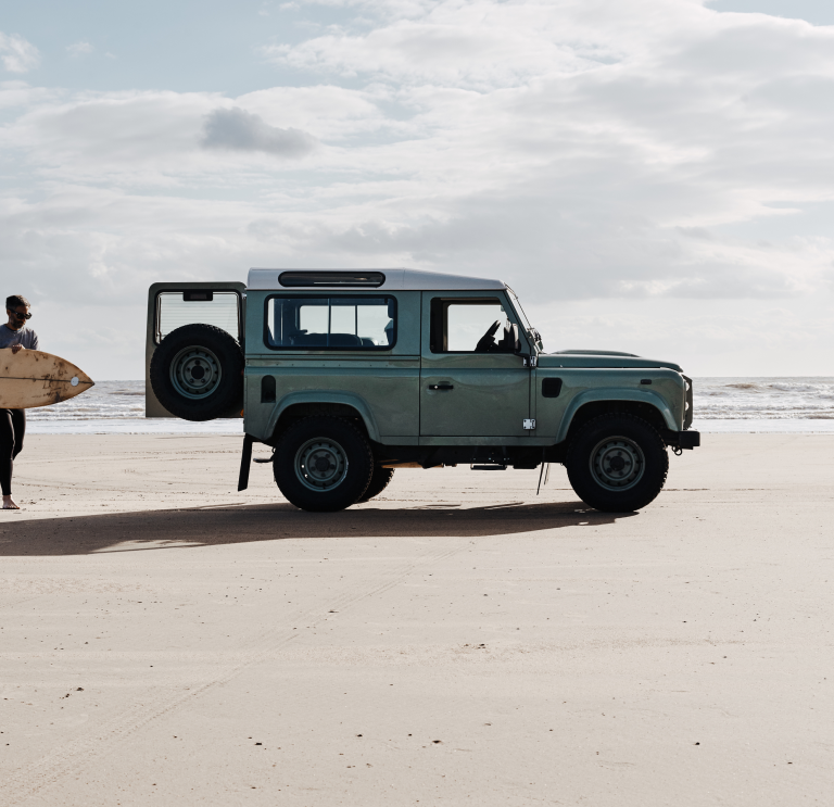 Surfer and van, Rest Bay