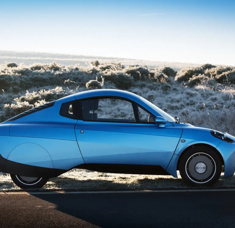 Side view of Riversimple Rasa hydrogen car on desert background