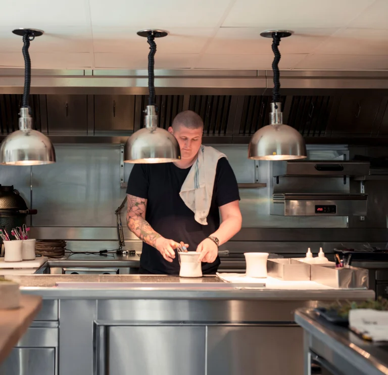 kitchen with man (chef) preparing food