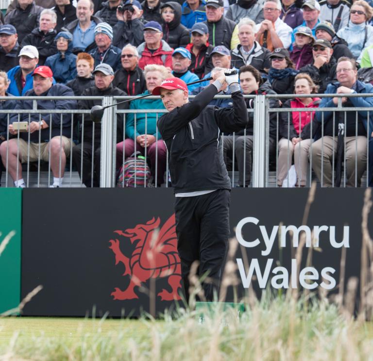 Phil Price playing golf at the Senior Open 2017 Royal Porthcawl Golf Club and crowd watching