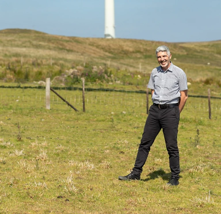 Derek  Walker standing in a field