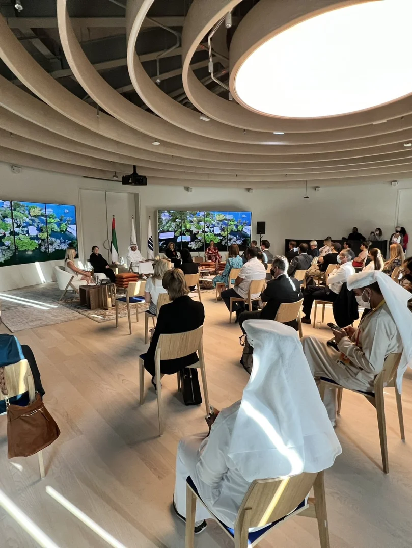 Sophie Howe speaking on a panel to a seated audience at Expo's Sustainability for All World Majlis during Climate & Biodiversity Week at the UK Pavilion